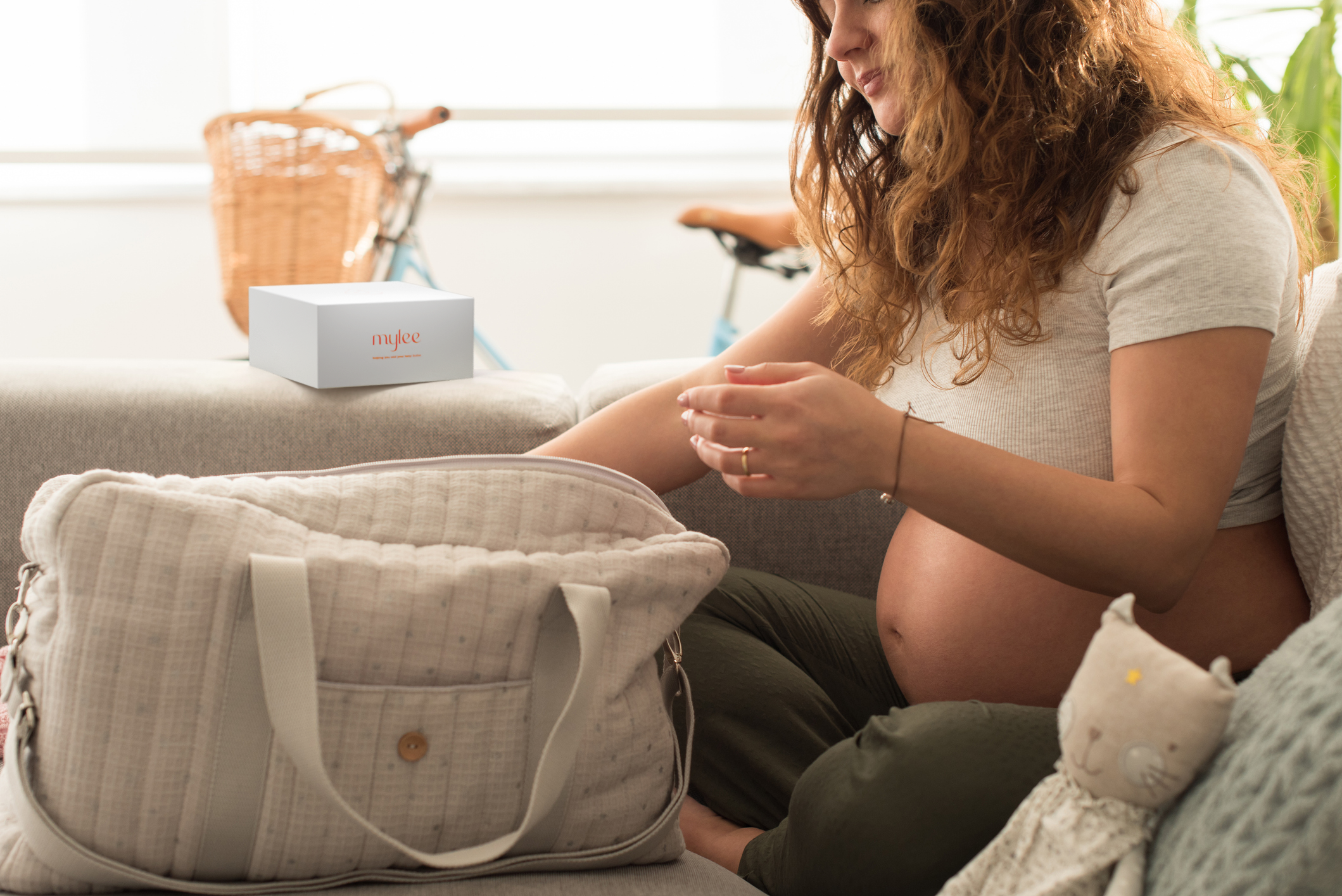 expecting mother packing her hospital bag with MyLee milk / colostrum sensing device